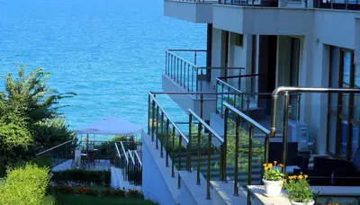 a balcony of a building with a view of the ocean at Апартаменти Бяла Клиф на плажа - Apartments Byala Cliff First Line in Byala