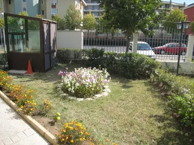 a garden with flowers in the middle of a street at SB Rentals Apartments in Royal Dreams Complex in Sunny Beach