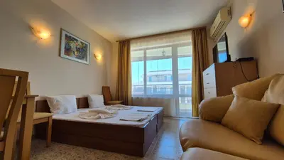 a living room with a bed and a couch at SB Rentals Apartments in Royal Dreams Complex in Sunny Beach
