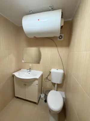 a small bathroom with a toilet and a sink at Casa Luba Sunny beach in Sunny Beach