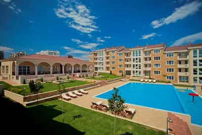 a large swimming pool in front of a building at Atia Resot in Chernomorets
