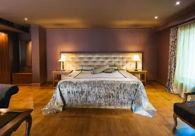 a bedroom with a large bed in a room at Ventura Boutique Hotel in Varna City
