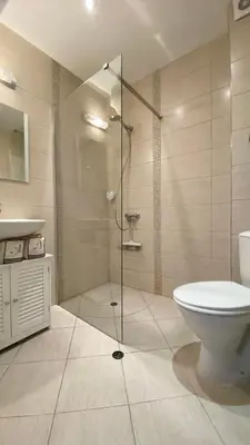 a bathroom with a shower and a toilet and a sink at APARTELLO Modern Apartment - Balkan Breeze 7 in Sunny Beach