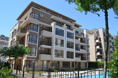 an apartment building with a pool in front of it at APARTELLO Modern Apartment - Balkan Breeze 7 in Sunny Beach