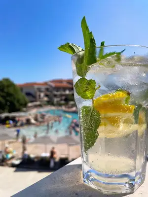 a glass of water with lemon and mint at HVD Clubhotel Miramar - 24 Hours Ultra All Inclusive & Free Parking in Obzor