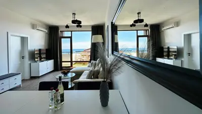 a living room with a hammock in the middle of the room at APARTELLO Modern Apartment - Garden of Eden in Sveti Vlas