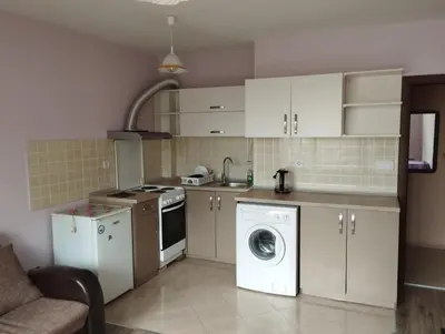 a kitchen with a washing machine and a washer at CITY STAY in Varna 2 in Varna City