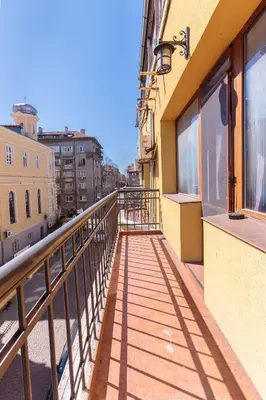 a balcony with a view of a city at СТАИ ЗА ГОСТИ ХАН КРУМ in Burgas City