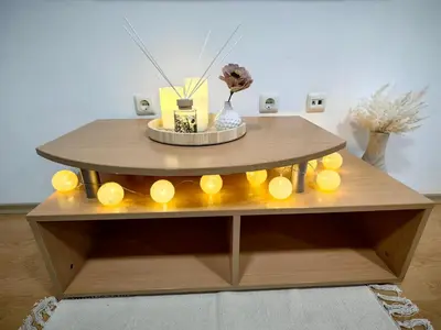 a coffee table with yellow lights on it at Niko Apartments in Sunny Beach