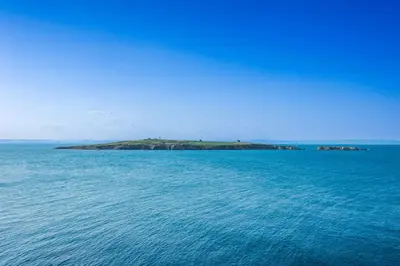 an island in the middle of a large body of water at Hotel Albatros Old Town in Sozopol