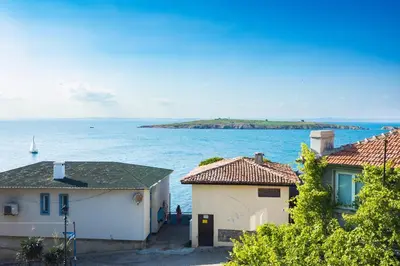 a view of the ocean from a house at Hotel Albatros Old Town in Sozopol