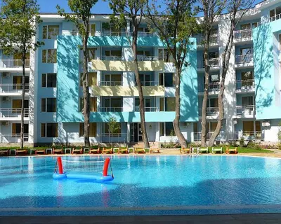 a swimming pool with a volley ball net in front of a building at MNG Holiday Yassen Apartments in Sunny Beach