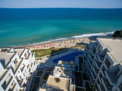 an aerial view of the beach and buildings at Penthouse at White Cliffs in Byala