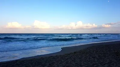 a beach with the ocean and the waves at Apartments Paskalina in Byala