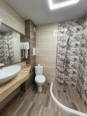 a bathroom with a toilet and a sink at Palma in Burgas City