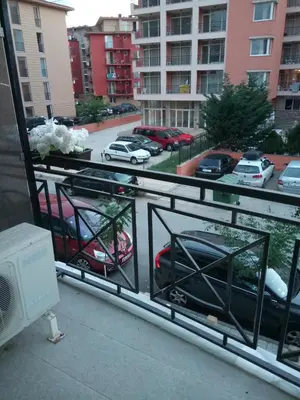 a balcony with a view of a parking lot with cars at Rainbow 3 Apartment-studio 223 in Sunny Beach