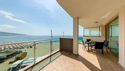 a balcony with a view of the beach at Briz Beach Apartments in Sunny Beach