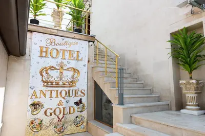 a sign for a hotel with a crown on it at Golden House in Varna City