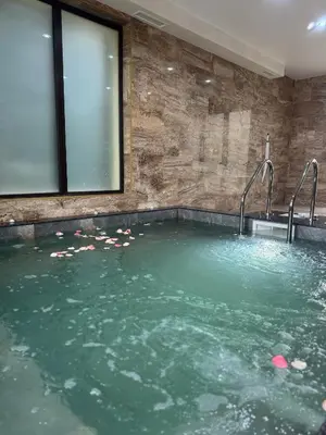 a large pool of water with two faucets at Alex Village in Shkorpilovtsi