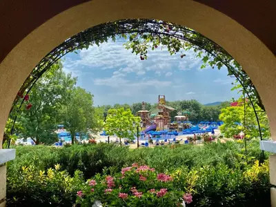 a view of a water park from an archway at Duni Belleville - All Inclusive in Sozopol