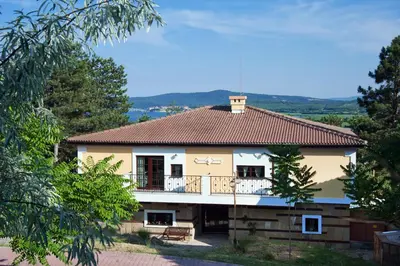 a house with a balcony with a roof at Duni Holiday Village - All Inclusive in Sozopol