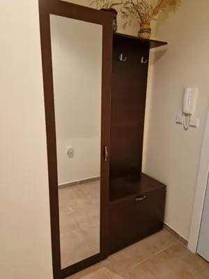 a wooden door with a mirror in a room at Słoneczny Brzeg Green Fort Noks Studio in Sunny Beach