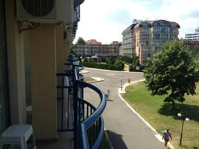 a balcony with a blue railing and a street at Hotel Pliska - All Inclusive Light in Sunny Beach