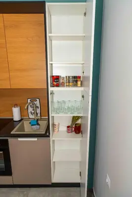 a refrigerator with its door open in a kitchen at Pomorie Seaside Apartments in Pomorie