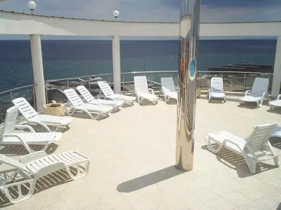 a group of chairs sitting on the deck of a cruise ship at Vista Del Mar Ap 22 in Ravda