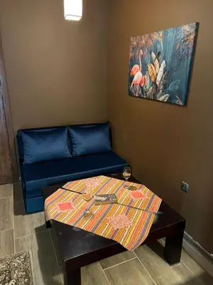 a living room with a couch and a table at Family Hotel Vaso in Varna City