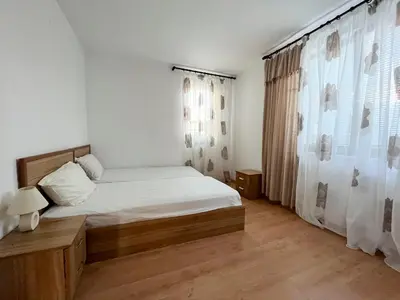 a small bedroom with a bed and a window at Комплекс «ТОП» in Sveti Vlas