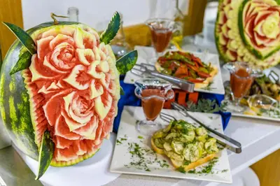 a table with several different types of food on plates at Diamond Hotel - All Inclusive in Sunny Beach