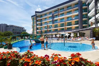 a group of people standing around a swimming pool at Diamond Hotel - All Inclusive in Sunny Beach