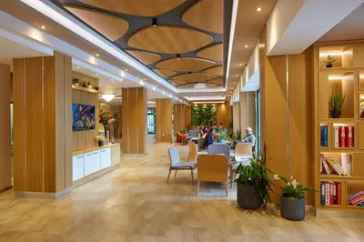 a lobby with a table and chairs in a building at Diamond Hotel - All Inclusive in Sunny Beach