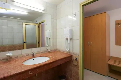 a bathroom with a sink and a mirror at Diamond Hotel - All Inclusive in Sunny Beach