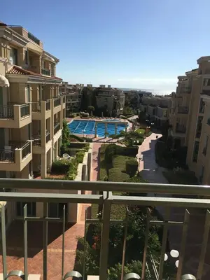 a view of a pool from a balcony of a building at FLORES GARDEN SEA VIEW APARTMENT WITH BALCONY in Chernomorets