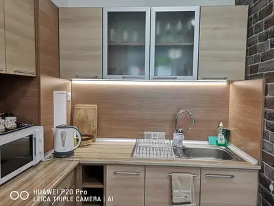 a kitchen with a sink and a microwave at Apartment SeaGarden 19 in Varna City