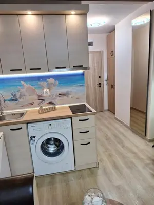 a kitchen with a washing machine in a room at Alex Studio, Sozopol, Kavaci in Sozopol
