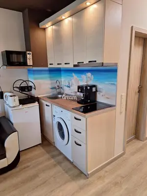 a kitchen with a sink and a washing machine at Alex Studio, Sozopol, Kavaci in Sozopol