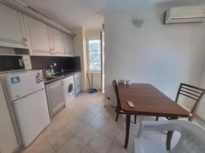 a kitchen with a table and a table and a dining room at Family apartment 