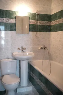 a bathroom with a sink and a toilet and a tub at Guest House Barbov in Obzor