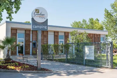 a sign in front of a building at Camping Gradina in Sozopol