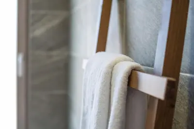 a towel hanging on a towel rack in a bathroom at Camping Gradina in Sozopol