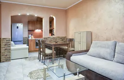 a living room with a couch and a table at South Beach Vacation Apartments in Sunny Beach