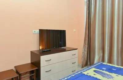 a bedroom with a tv on top of a dresser at South Beach Vacation Apartments in Sunny Beach
