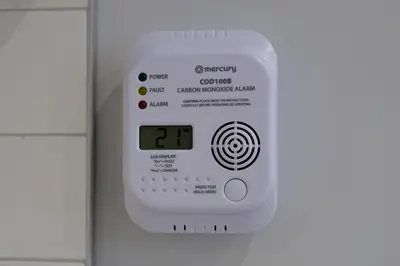 an electronic clock on a wall with a clock on it at The Olive Green House - City Center - Free Parking in Burgas City