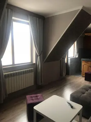 a living room with a couch and a table at Family Hotel Argo in Varna City