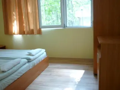 a bedroom with a bed and a window in a room at Nimpha Bungalows in Kamchia
