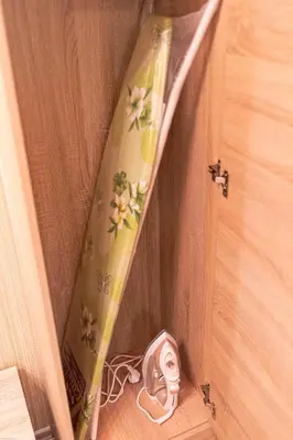 a surfboard sticking out of a door at Deluxe Studios City Center in Burgas City