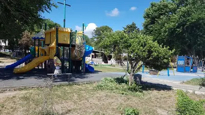 a playground with a slide in a park at Apartman Horizont II - side sea view in Sozopol